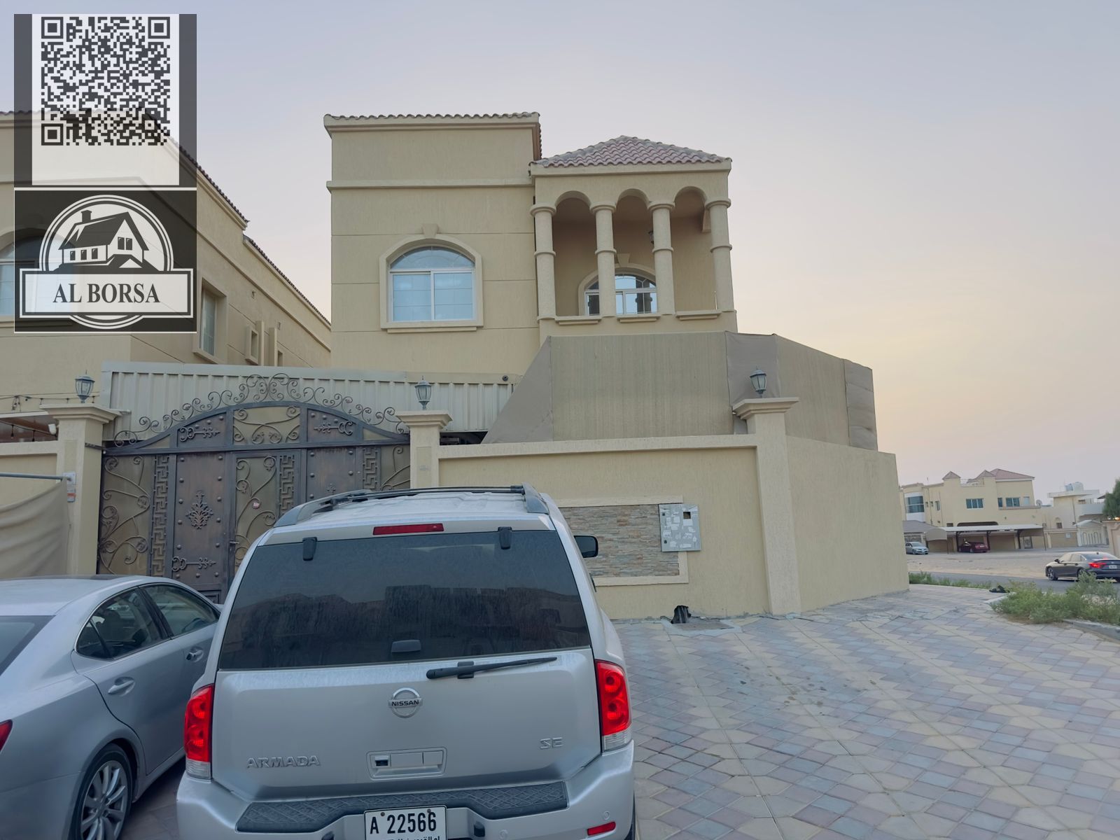 For sale in Al Muwaihat 2, a corner villa with five master bedrooms, a majlis, a living room, and a maid's room.