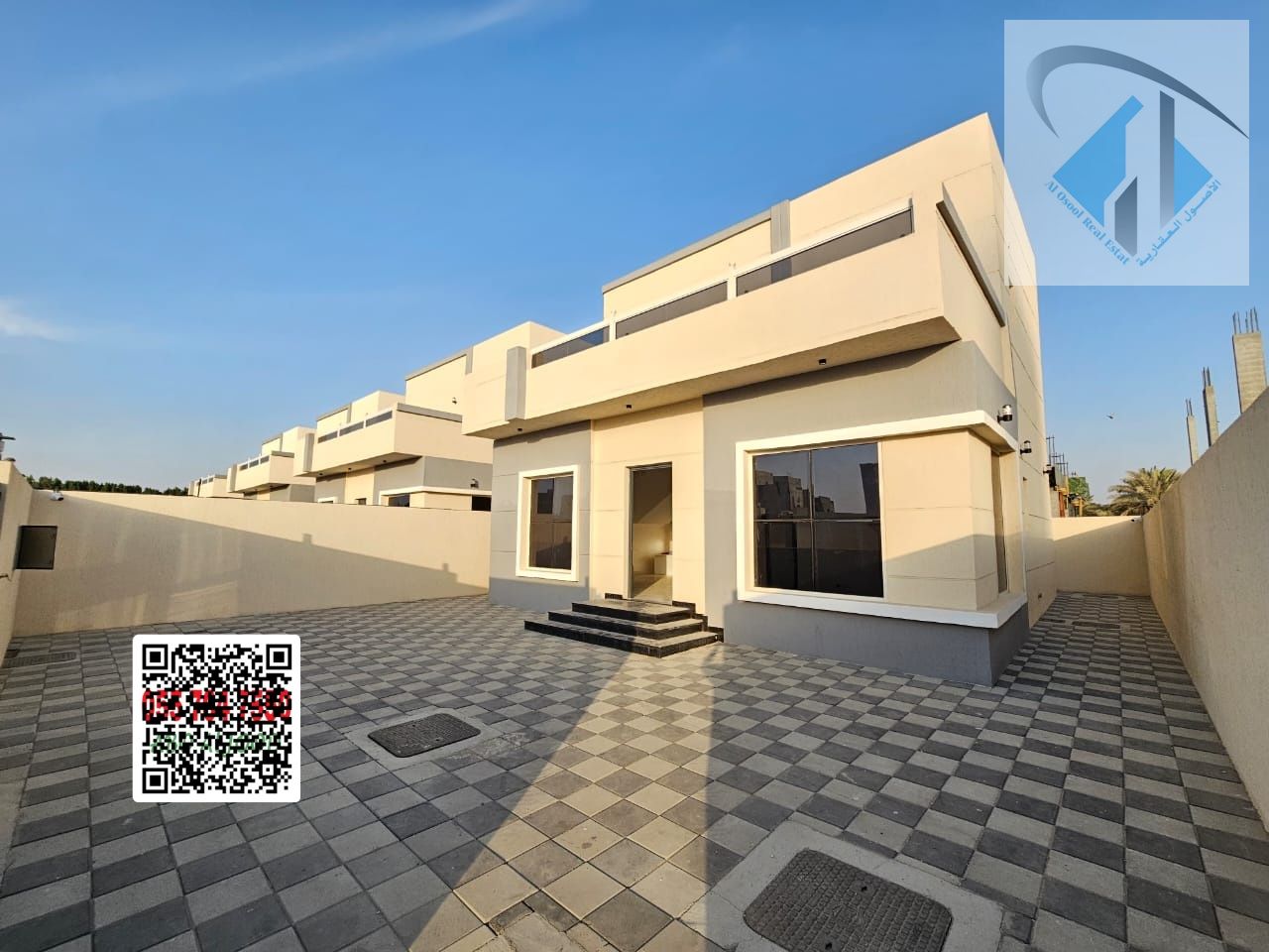 Villa for sale, all fees included, with a large yard, opposite Sheikh Mohammed Bin Zayed Road, freehold ownership.