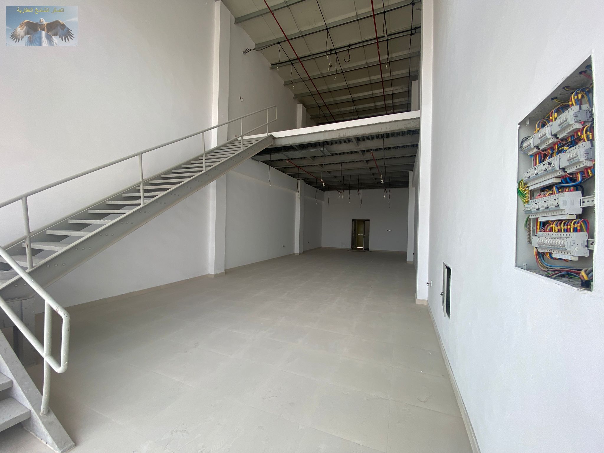 Warehouse in Al Mowaihat for annual rent, 2200 sq ft with mezzanine, suitable for all commercial activities, annual price 200,000 AED with four flexib