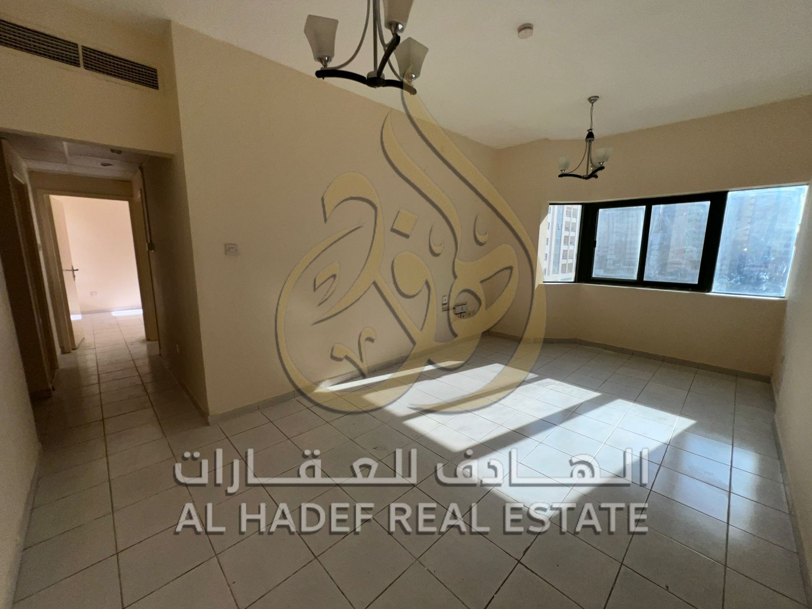 Sharjah Emirate, Al Nahda area, available apartment consisting of two bedrooms and a hall with two bathrooms and a balcony with an open view, close to