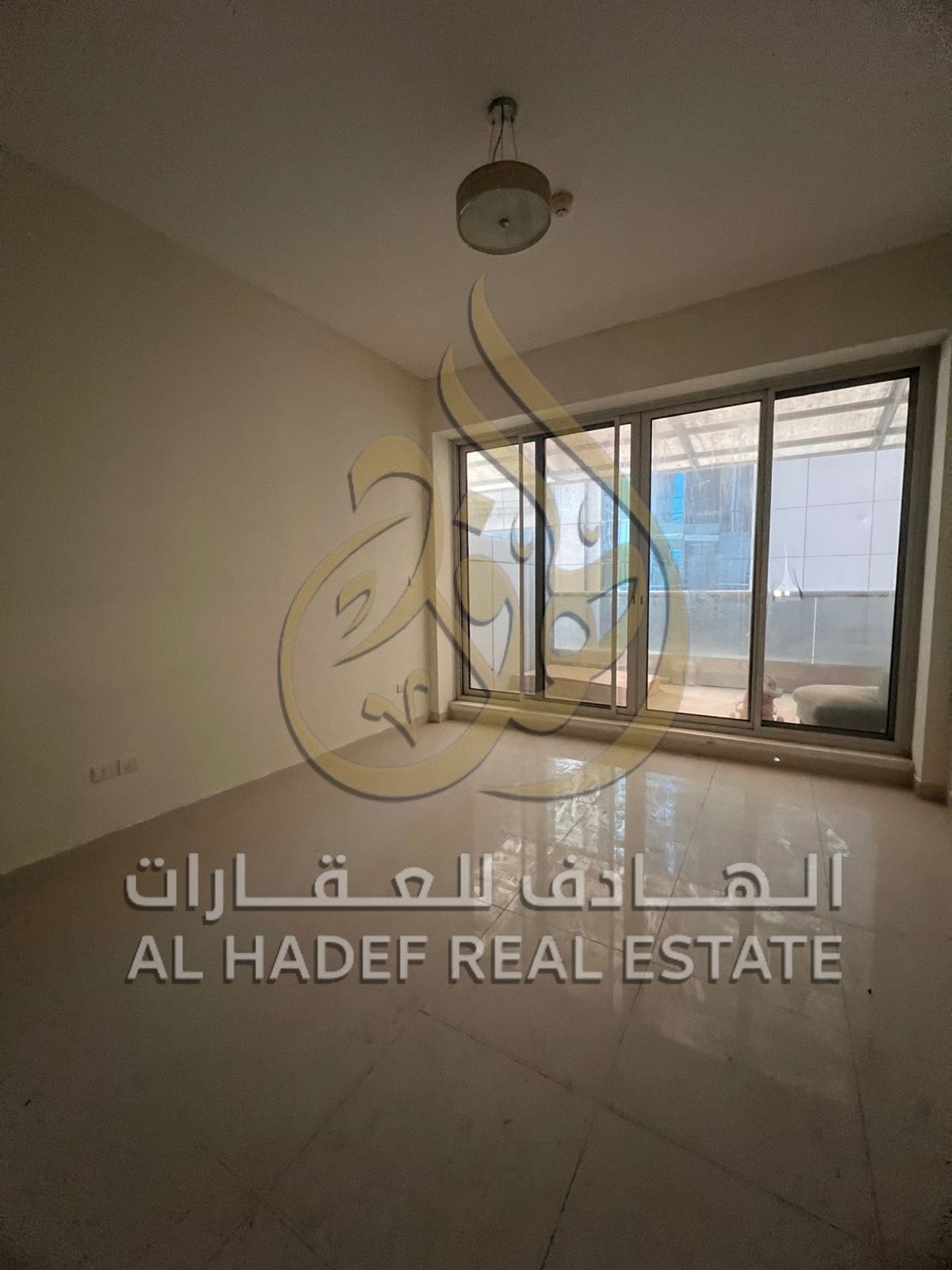 Sharjah Emirate, Al Nahda area, a two-bedroom apartment with a large living room, a balcony, three bathrooms, a parking space, a gym, a swimming pool,