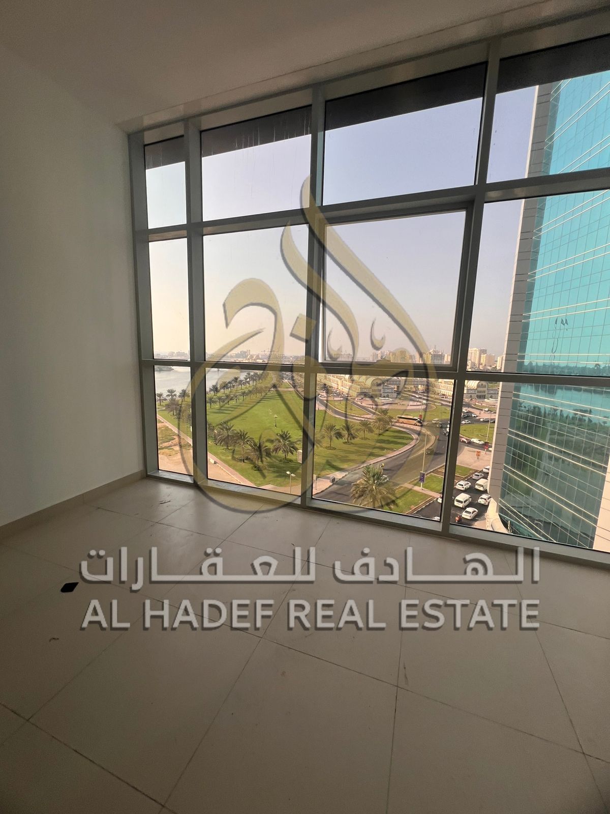 For rent in Al Majaz 1 - a luxurious apartment with 3 bedrooms and a hall , 2 parking spaces, and a gym