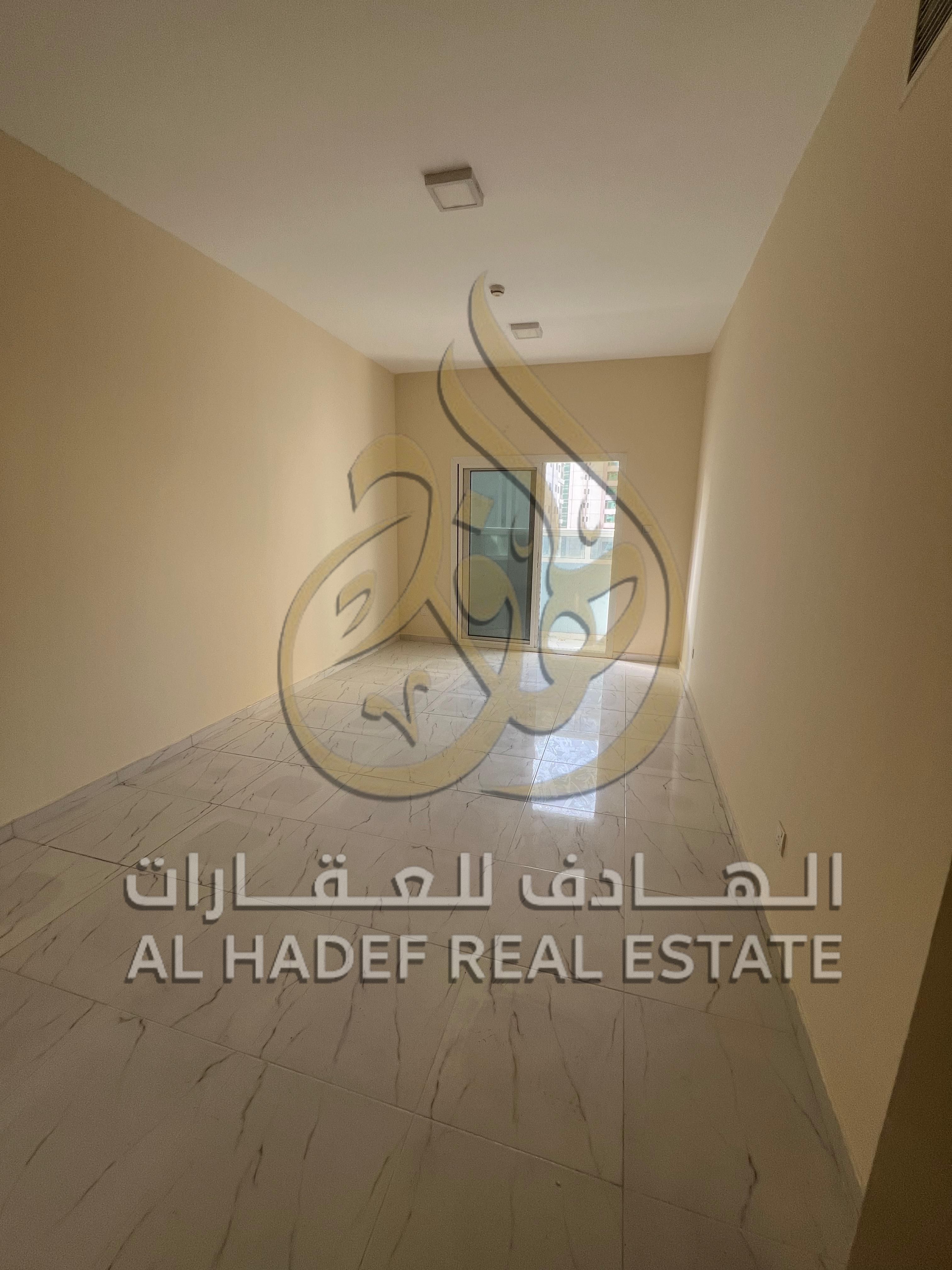 Two-bedroom apartment with a living room, two bathrooms, and a balcony for annual rent in Sharjah, Al Majaz 2 area.