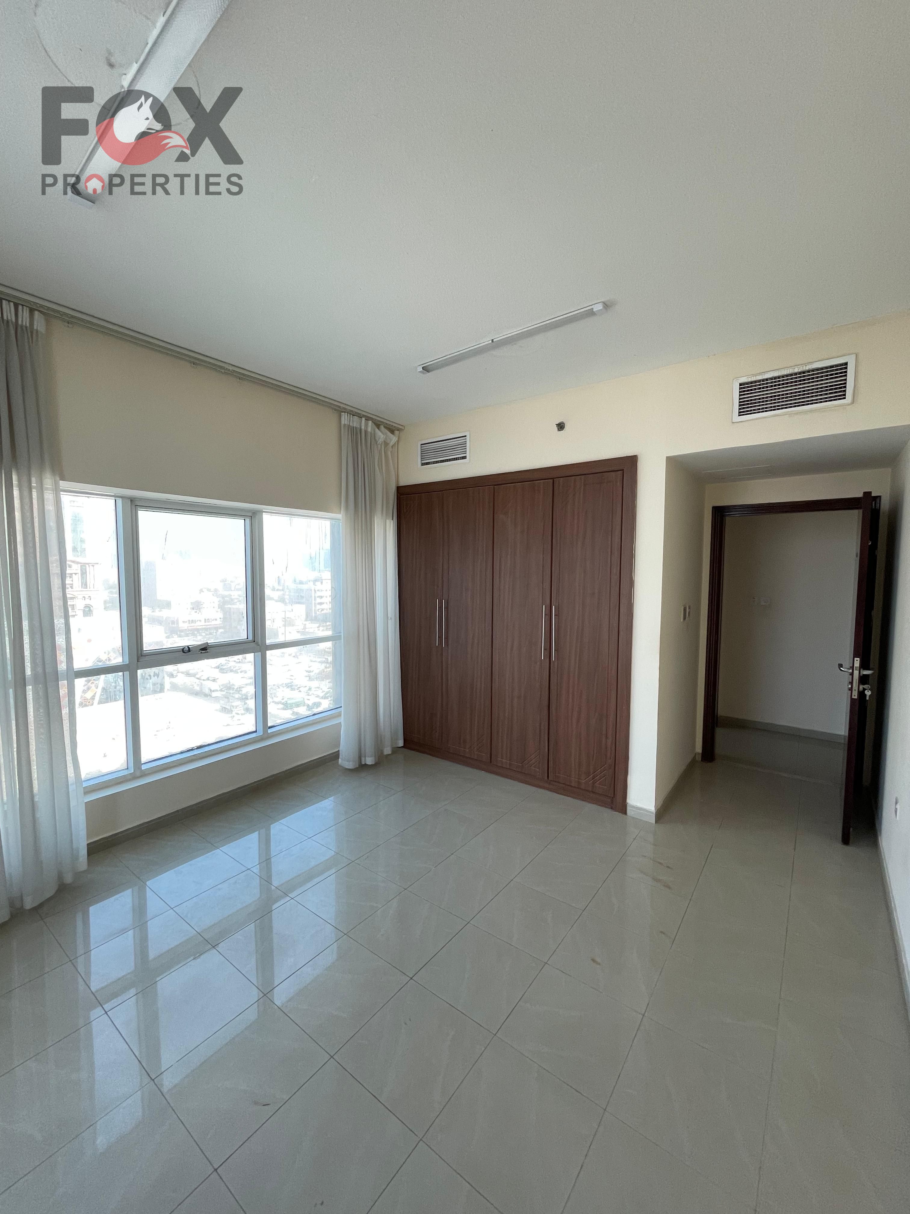 Spacious 2BHK apartment with built-in wardrobes for annual rent in Ajman Al Rashidiya 3, with private parking, great view, and prime location