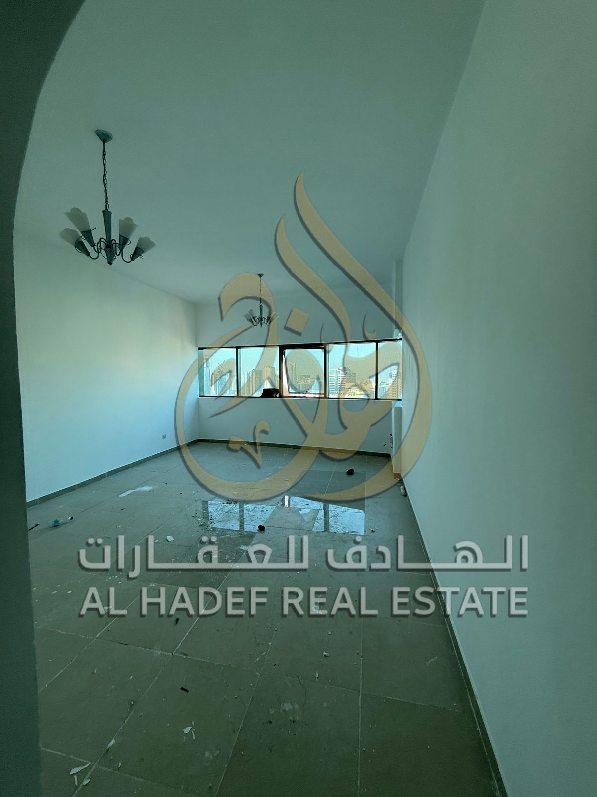 Here is the English translation: **“A -bedroom apartment with a living room for annual rent in Al Taawun, with a gym, separate swimming pools for