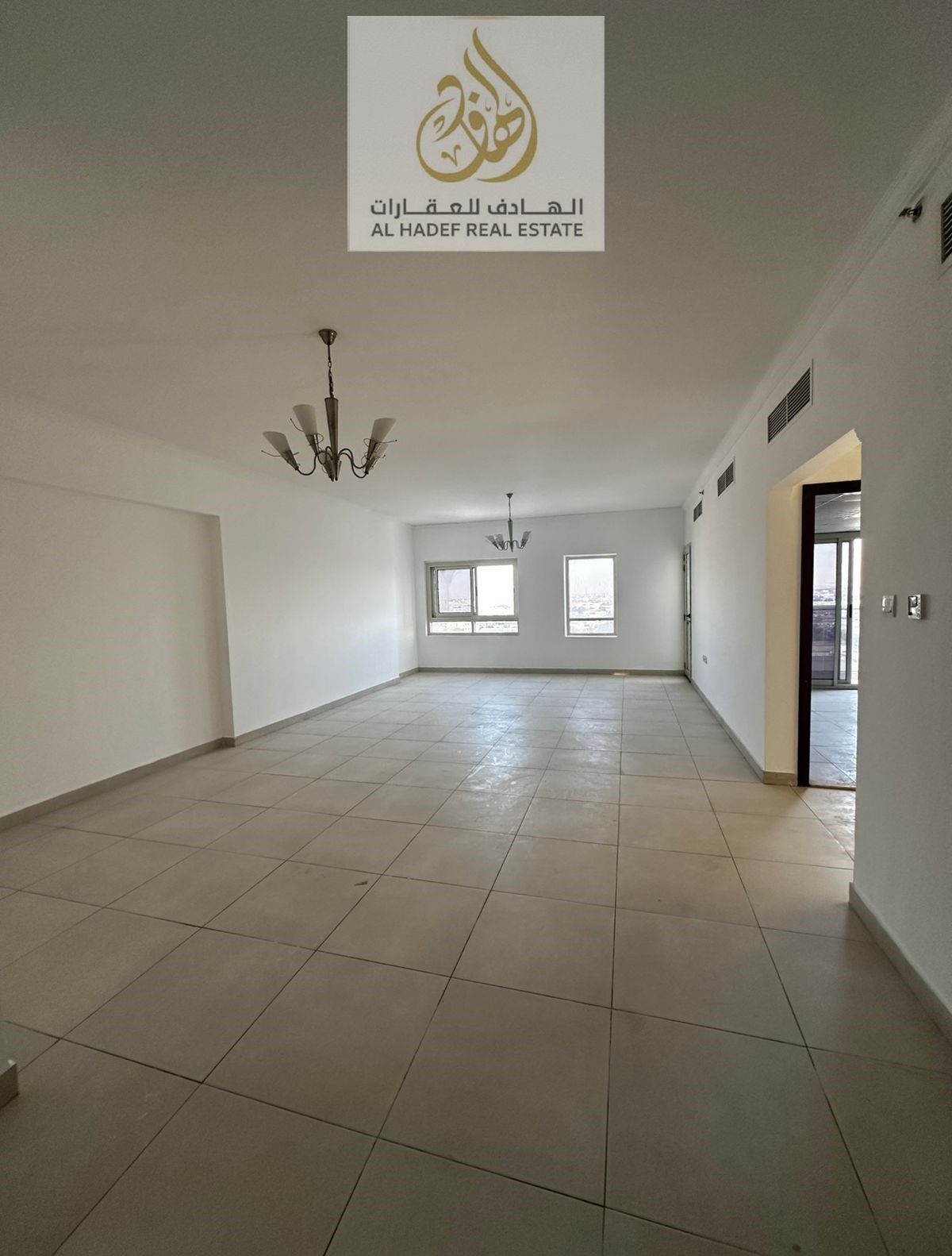 Two rooms and a hall, one of the largest apartments available for annual rent in Ajman, with parking and a free month