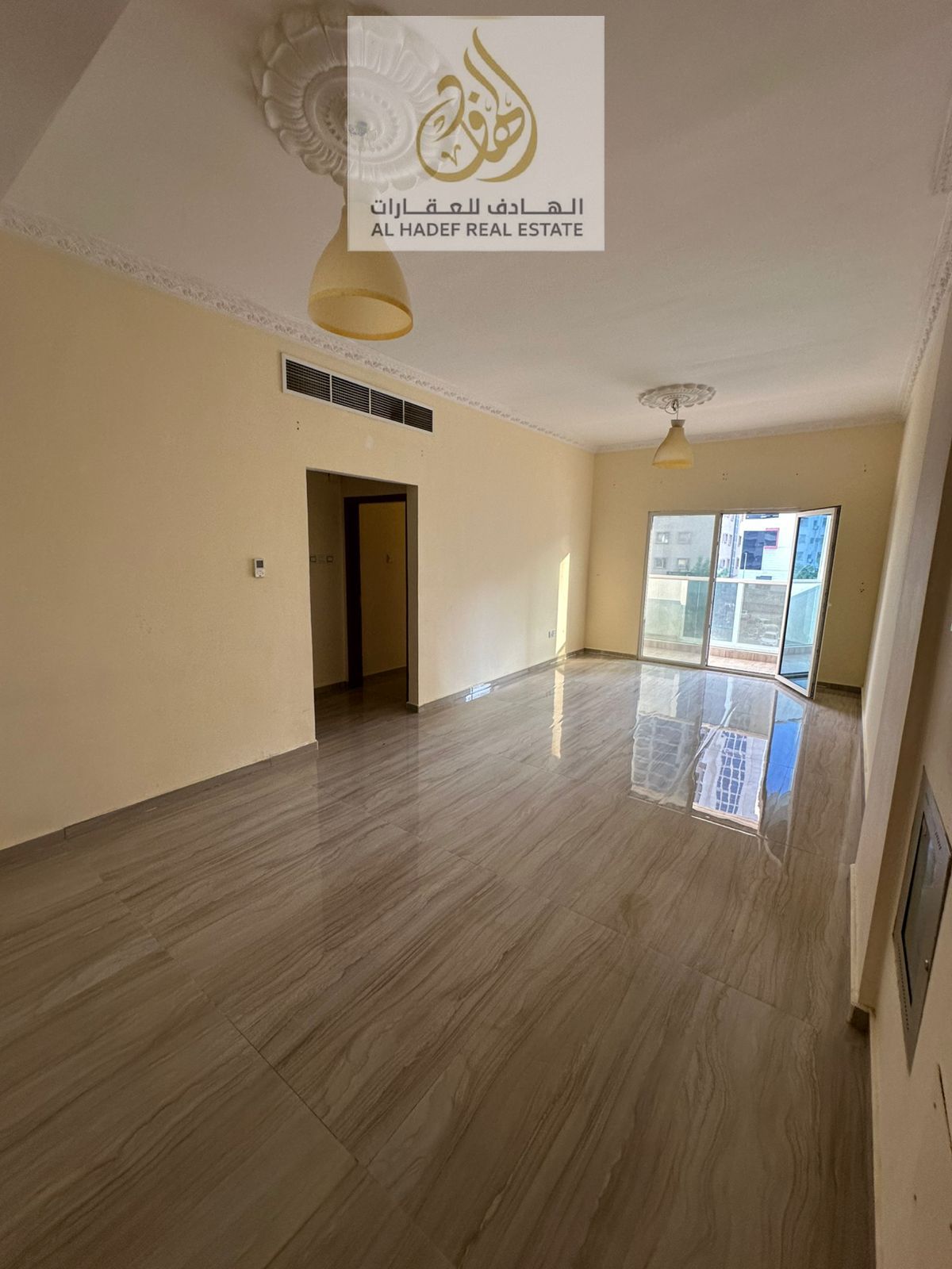 A room and a hall, second floor, for annual rent, Al Rashidiya 3