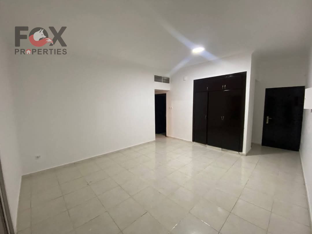 One bedroom and living room for annual rent in Al Rashidiya 3, next to Ajman One, with a balcony, open sea view, and built-in wardrobes.