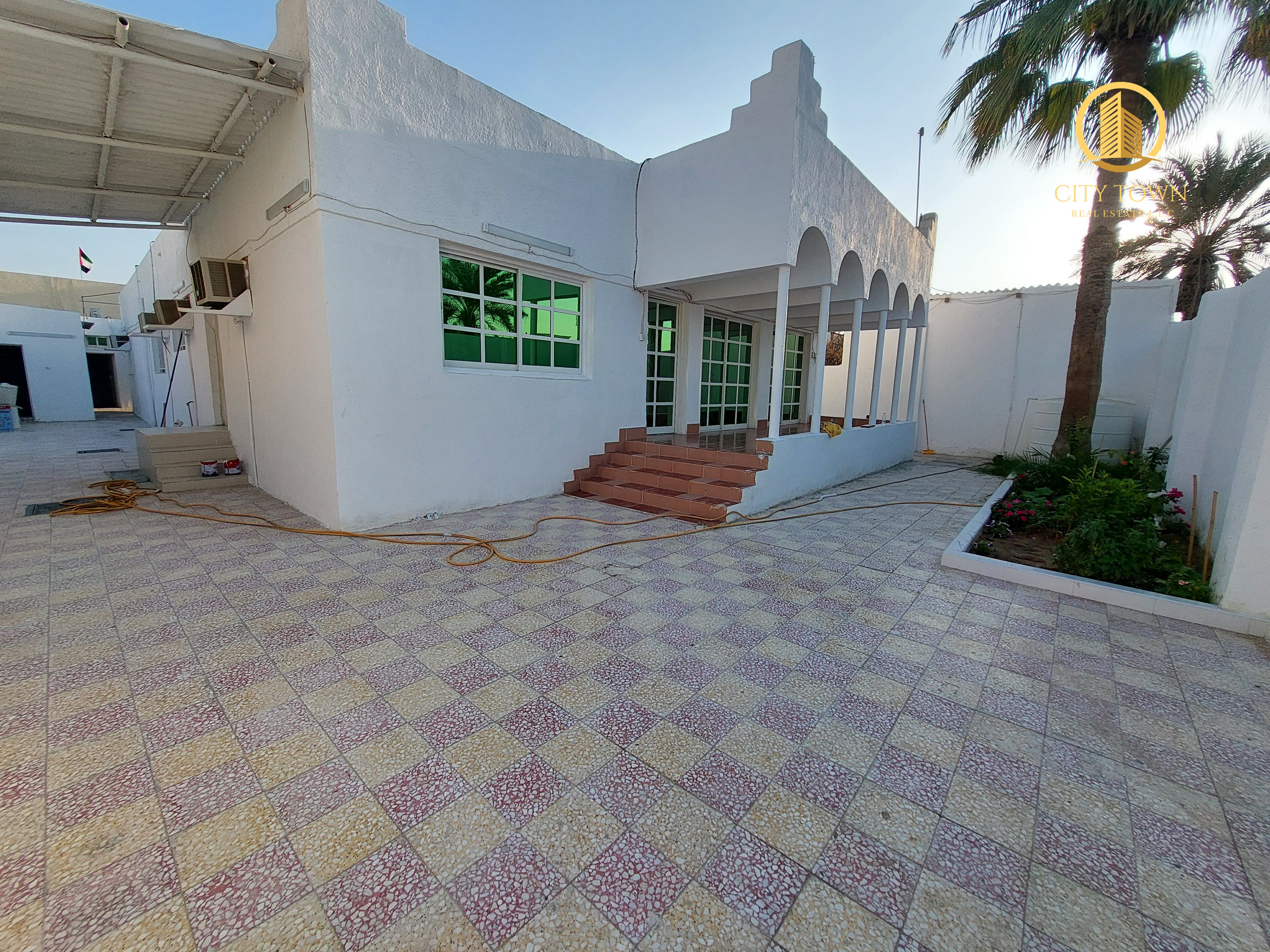 Spacious 5 bedroom villa with hall majlis maids room & garden area , covered parking area