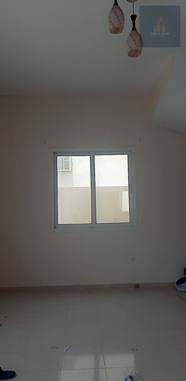 For sale Ground floor house in Umm Khanoor, Sharjah, located on two paved roads