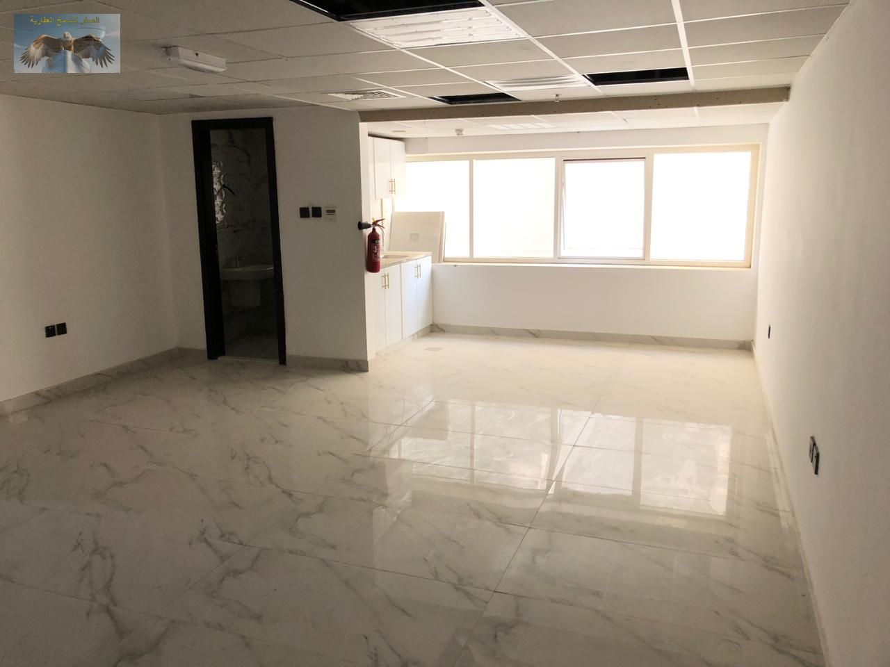 For annual rent in Ajman, a prime commercial office in Al Muwaihat 3, on a main street in a vibrant location suitable for all activities.
