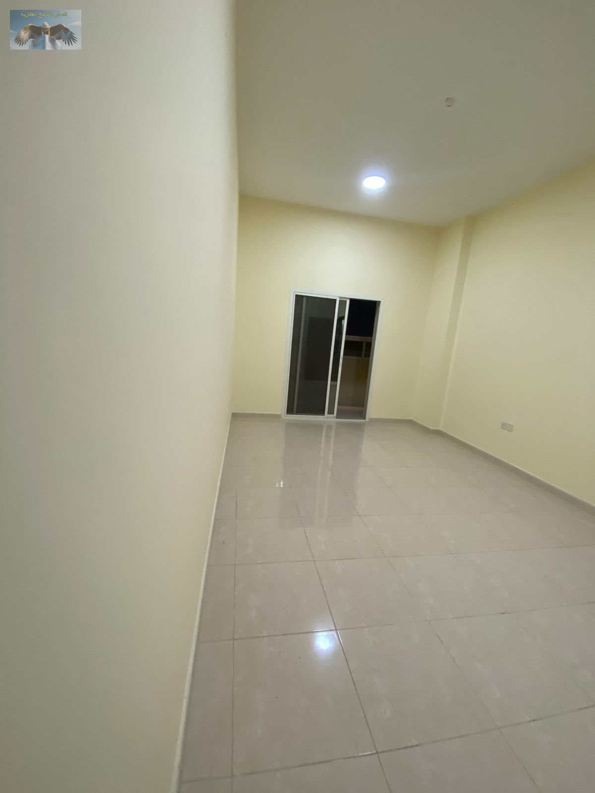 One-bedroom hall with open-view balcony in Al Rawda 3. Modern building with CCTV, regular maintenance and cleaning, close to Sheikh Ammar Street and a