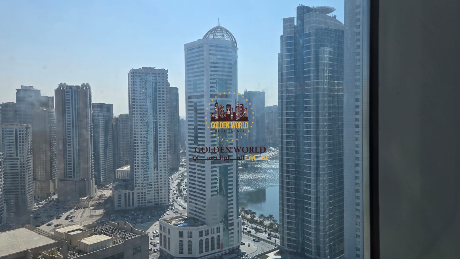 2BR hall in Al Khan near Nesto, open & partial sea view, panoramic windows, 2 master baths, parking, gym, and smart compact living spaces.