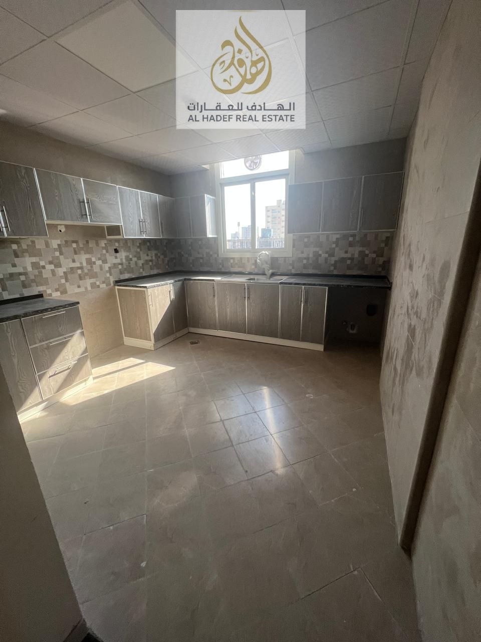 Annual rent in Ajman, Al Jurf 3 area. Brand new building, first occupancy for families. Two-bedroom apartment with a living room. The living room is s
