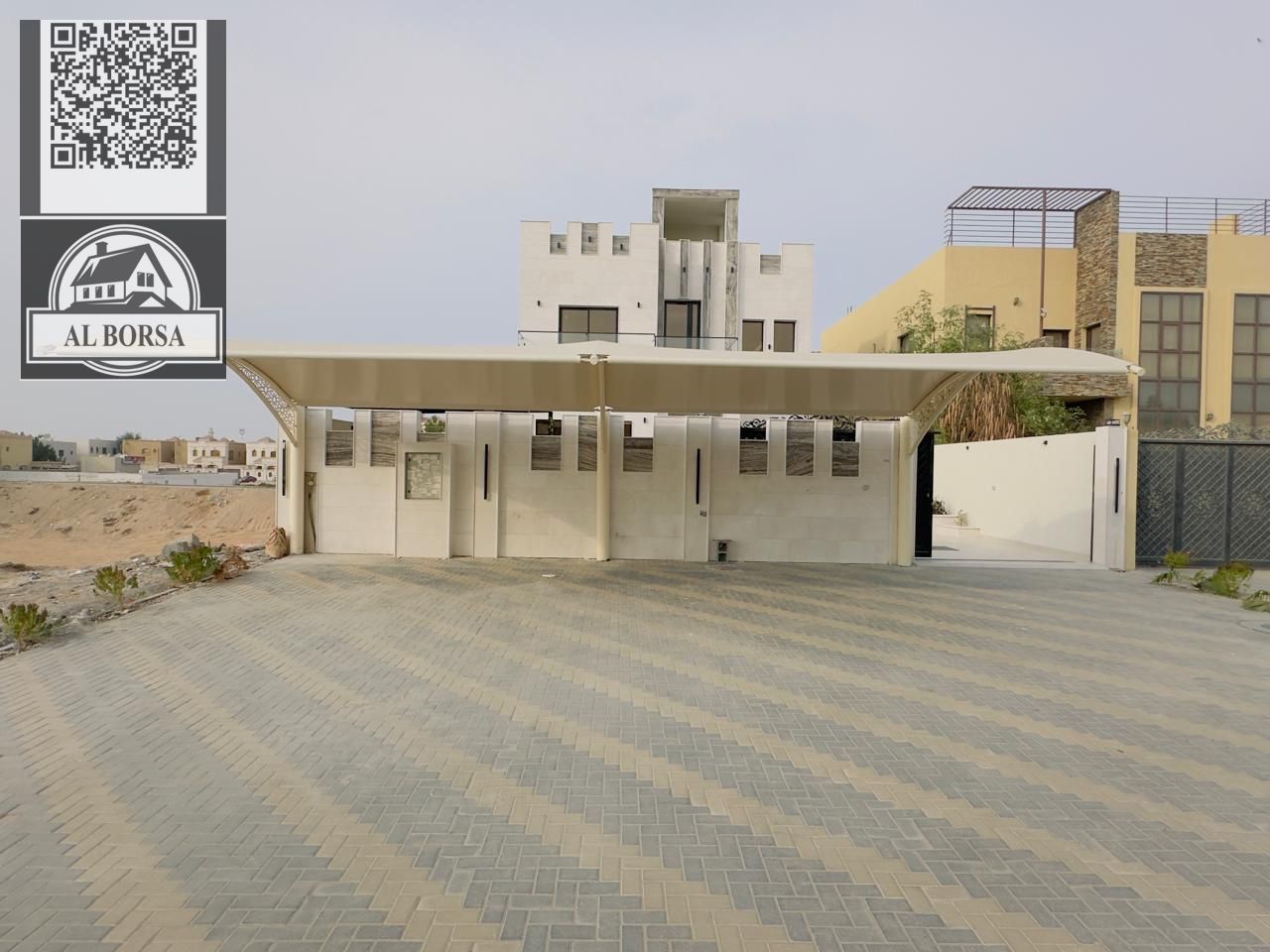 For sale: A luxurious villa in Al Muwaihat 1 consisting of 5 master bedrooms, a majlis, a living room with a kitchen, and a maid's room.