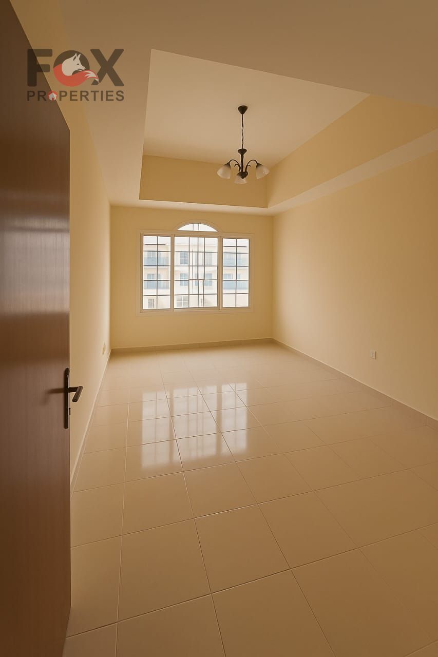 Uptown villa for annual rent: 3 bedrooms, living room, majlis, balcony, parking, and 3 bathrooms. Located near the Dubai and Sharjah exit.