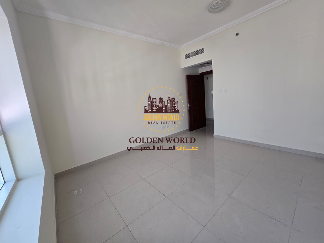 Elegant 2-master-bedroom apartment with a living room, balcony, maid’s room, and parking for rent in Al Taawun, Sharjah near the Dubai exit, offering