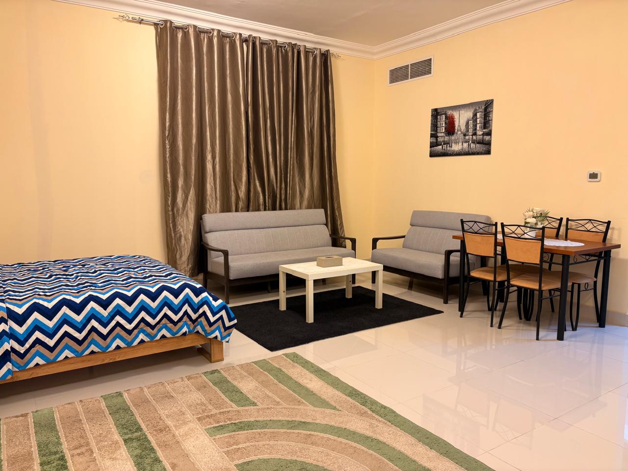 Studio for rent in Al Hurf with new furniture large space separate kitchen family residence prime location close to Dubai exit