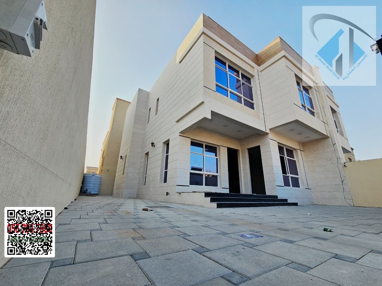 A unique opportunity: Own a villa directly opposite the mosque, with a large yard, fully stone facade, prime location, freehold ownership, and a negot