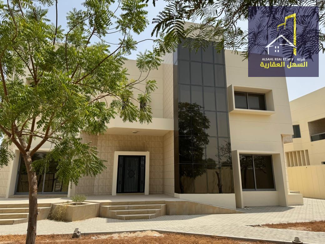 For sale in Al Suwaihat, Sharjah: a two-story villa with central air conditioning.