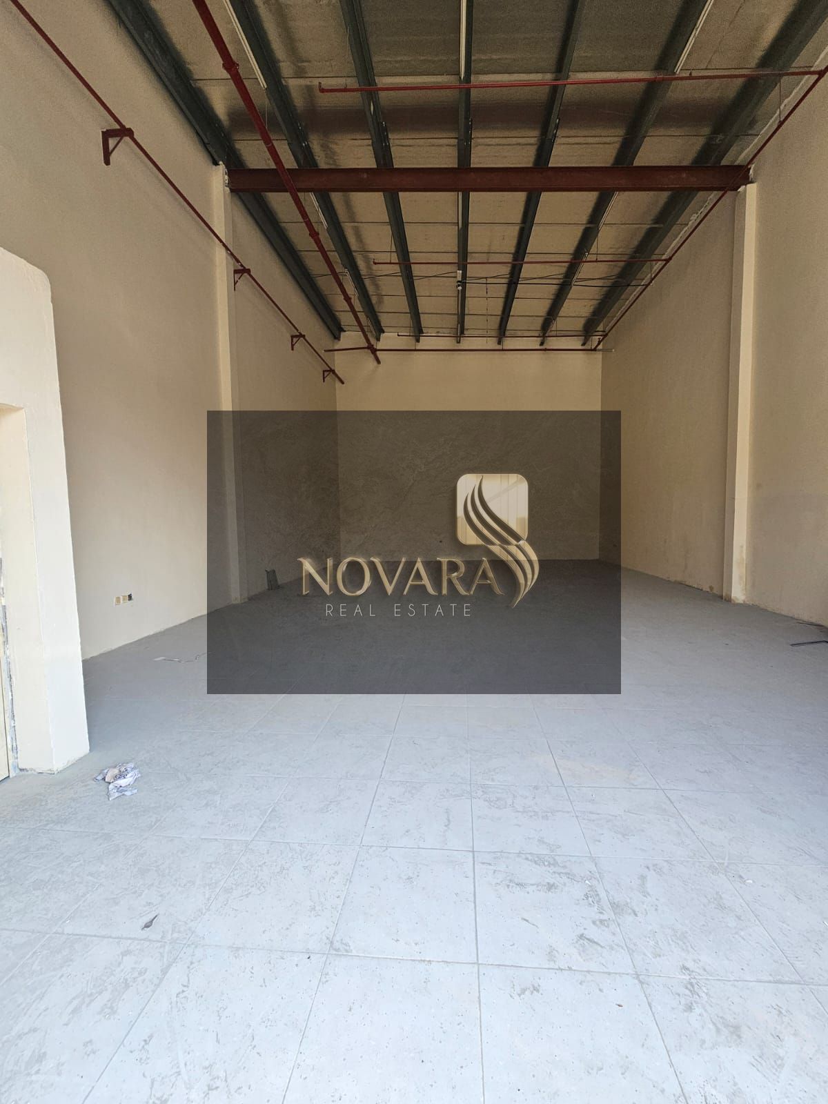 2000 sqft warehouse in Al Jurf Ind. 1 on main road, no mezzanine, 25 kW power, l —perfect location for your business.