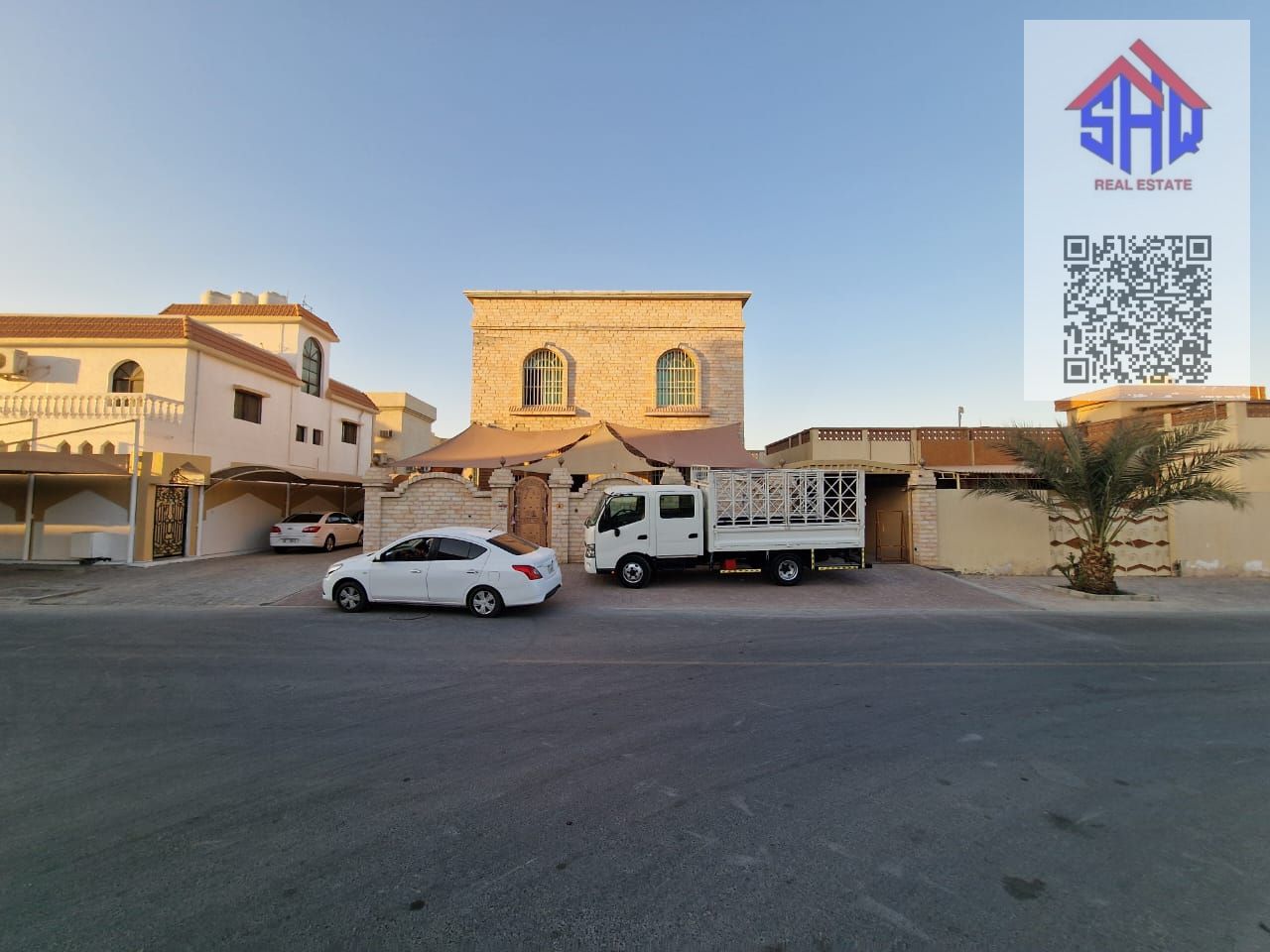 Villa for sale in Al Rawda area, opposite a mosque. Includes water, electricity, and air conditioning. Five rooms, living room, and maid's room.