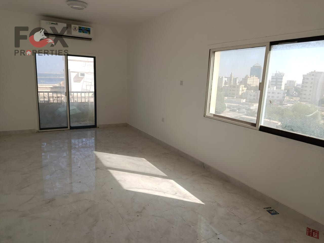 Two-bedroom apartment with a living room, directly overlooking the Ajman Corniche, in a prestigious location with sea views, two balconies, and a spac