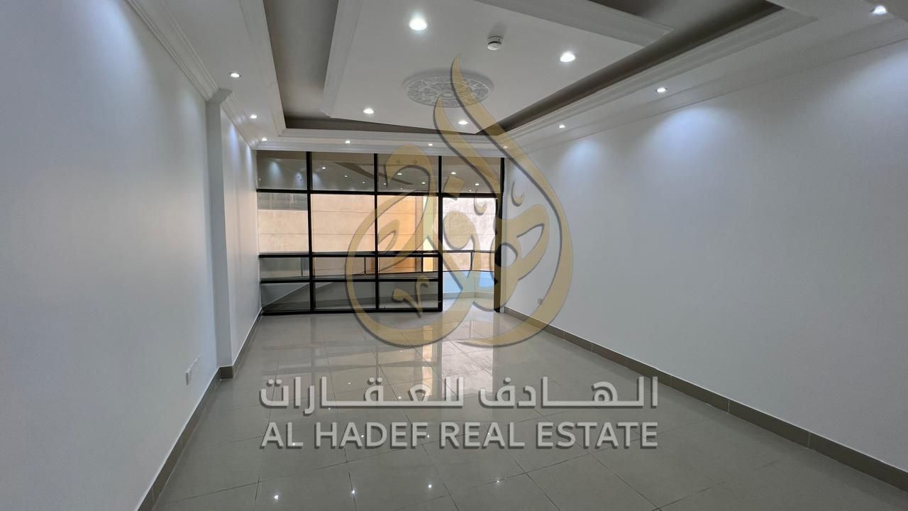 For annual rent in Sharjah, Al Majaz 2 area: a 2-bedroom apartment with a living room, 2 bathrooms, a distributor, and 2 balconies with a side view, n
