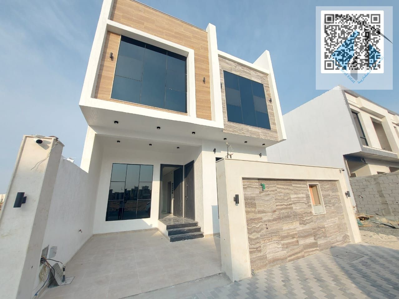 Townhouse for sale in Ajman, Al Zahiyah area, including registration fees. Freehold ownership for all nationalities, with monthly installments for 25