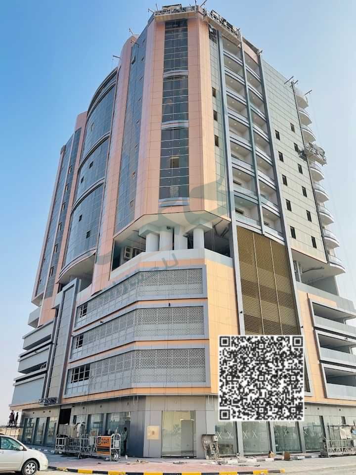 A room and hall for sale on installment from the developer in Al-Ghoroub Tower, ready for handover with a down payment and 7 years installment plan wi