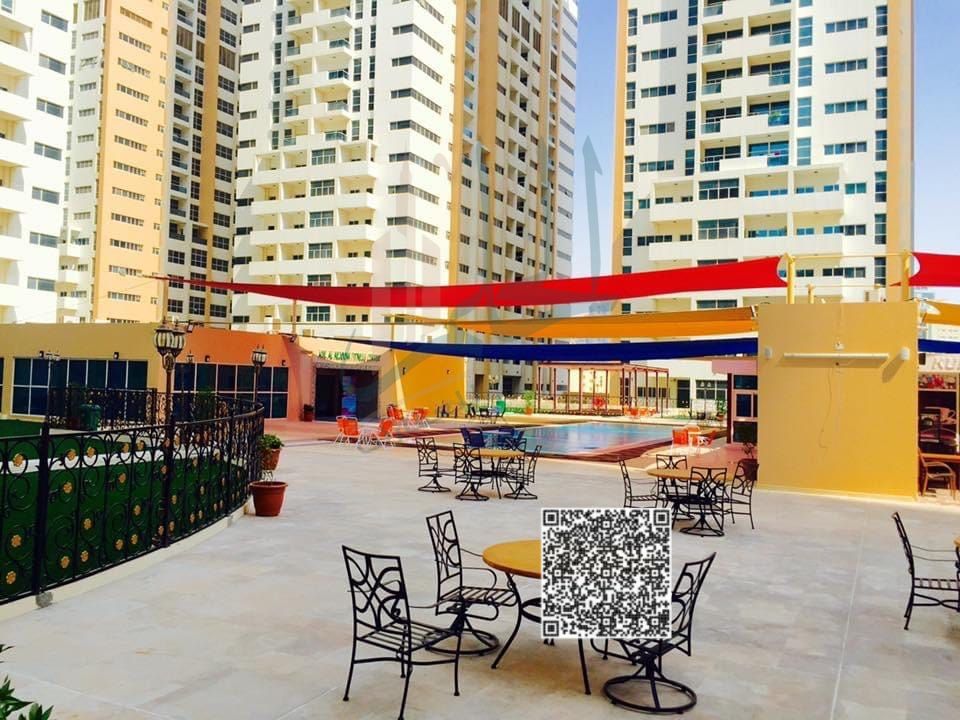 Luxury three-bedroom apartment with a living room in Ajman One, offering a full sea view overlooking the Corniche. The apartment features