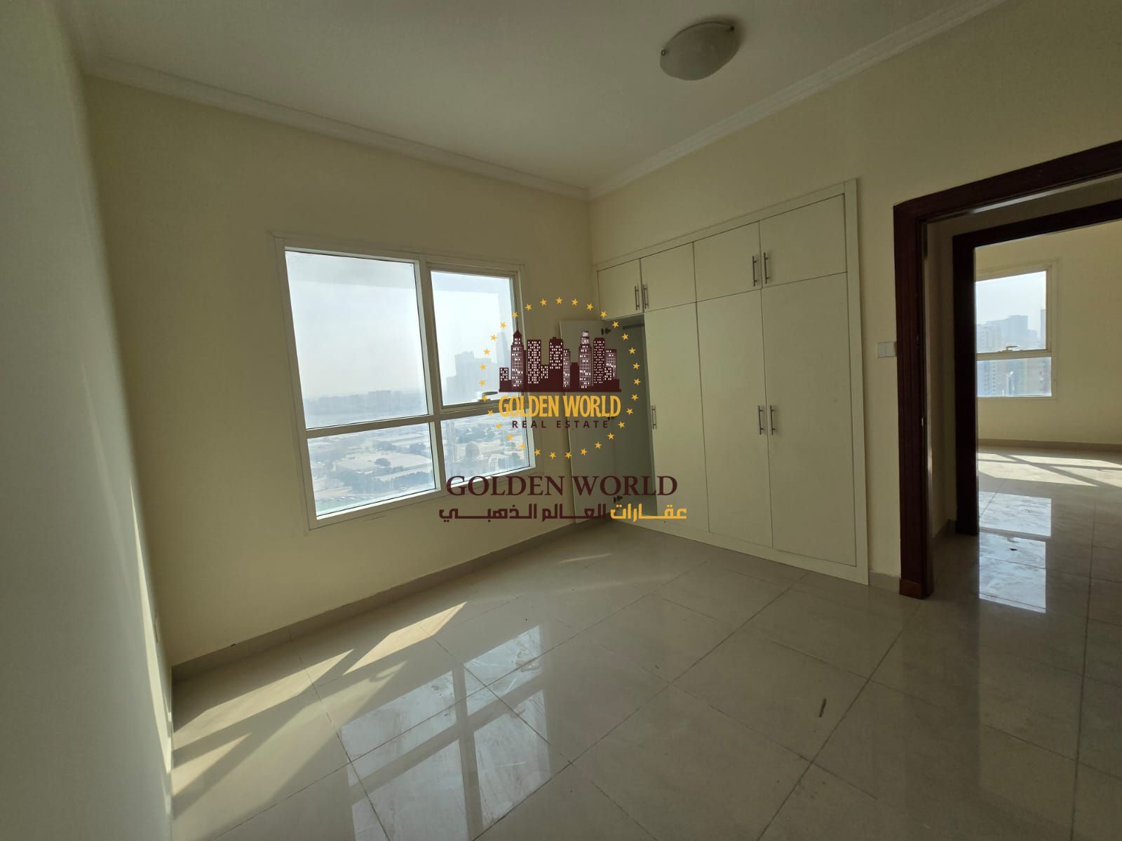 Three-bedroom apartment with living room and parking in Sharjah Al Taawun Dubai Exit, featuring bright open views, high cleanliness, a master bedroom,
