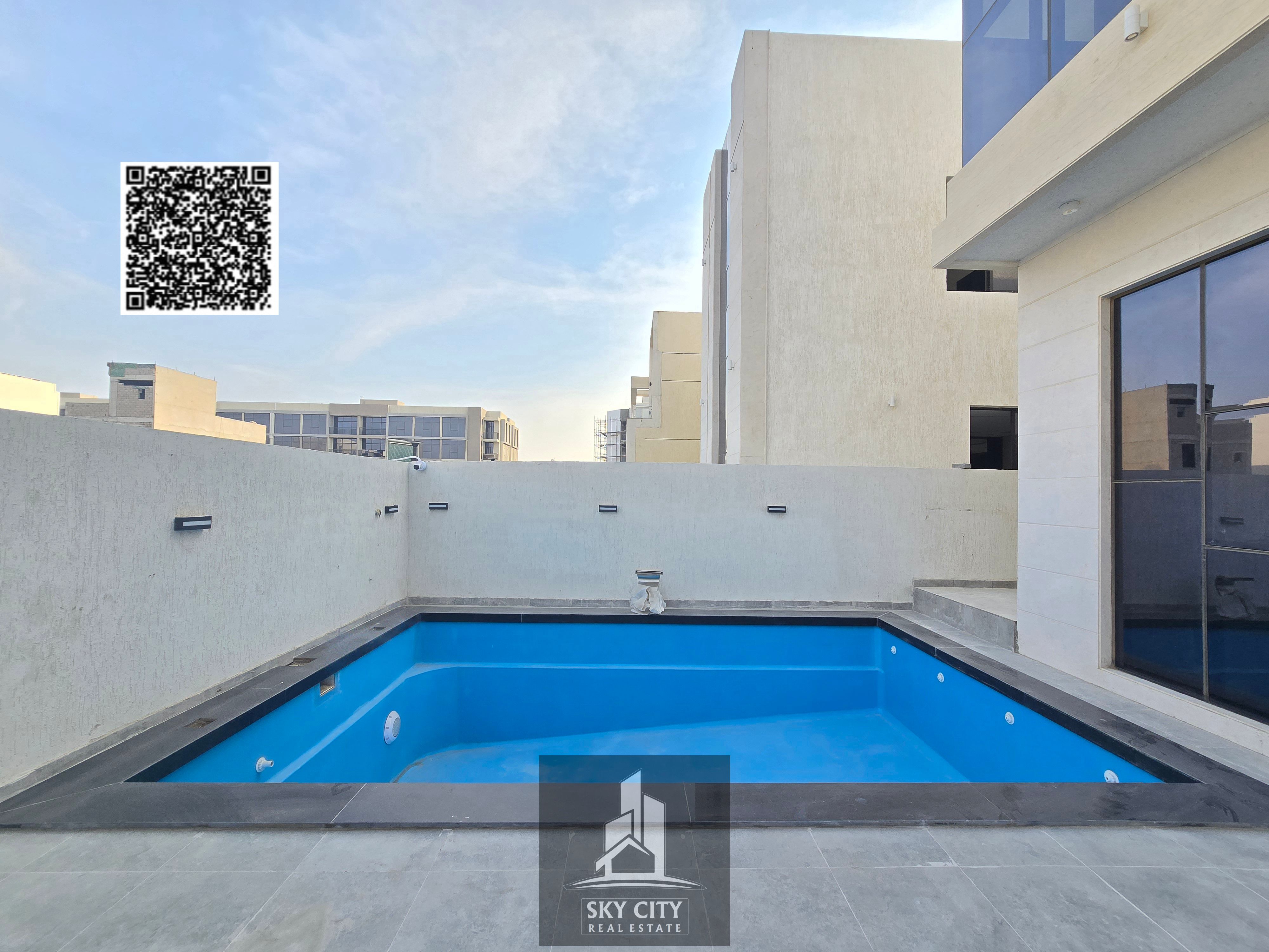 Villa for sale on Sheikh Khalifa Street, opposite Al Hamidiya Park, behind the mosque, including registration fees and a swimming pool.
