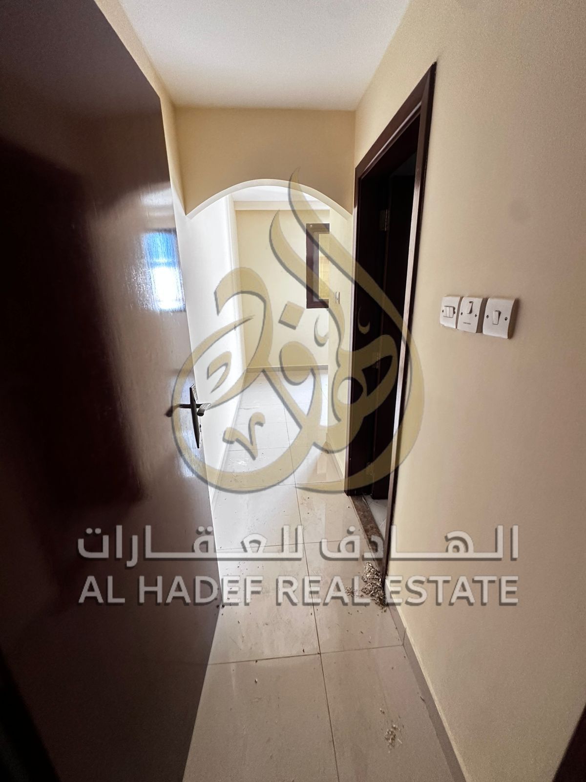 For annual rent in Sharjah, Al Qulaya: a two-bedroom apartment with a master bedroom, living room, three bathrooms, balcony, and kitchen with built-in