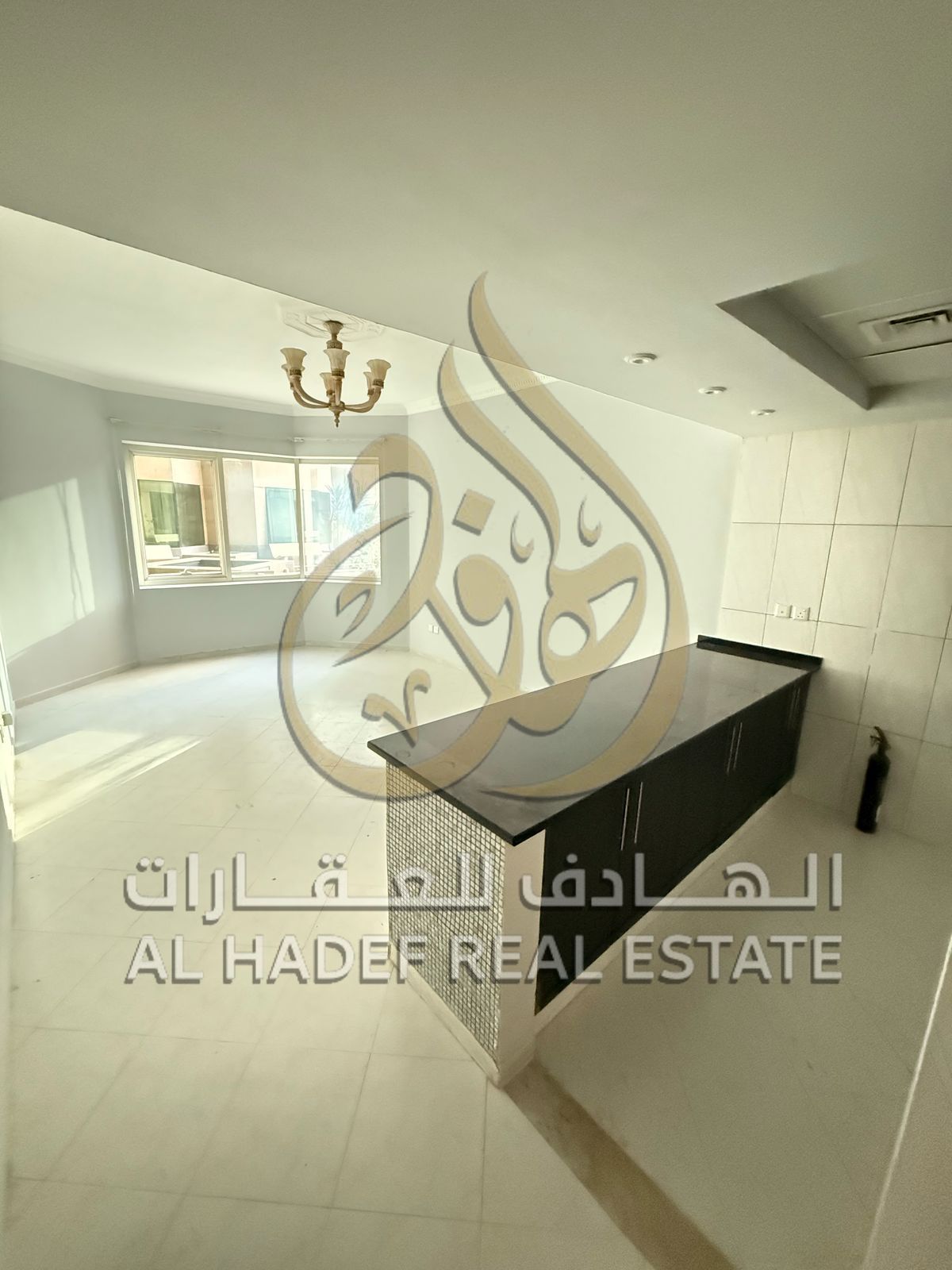 A unique opportunity in Al Khan – a bedroom and living room with a gym, swimming pool, and free air conditioning