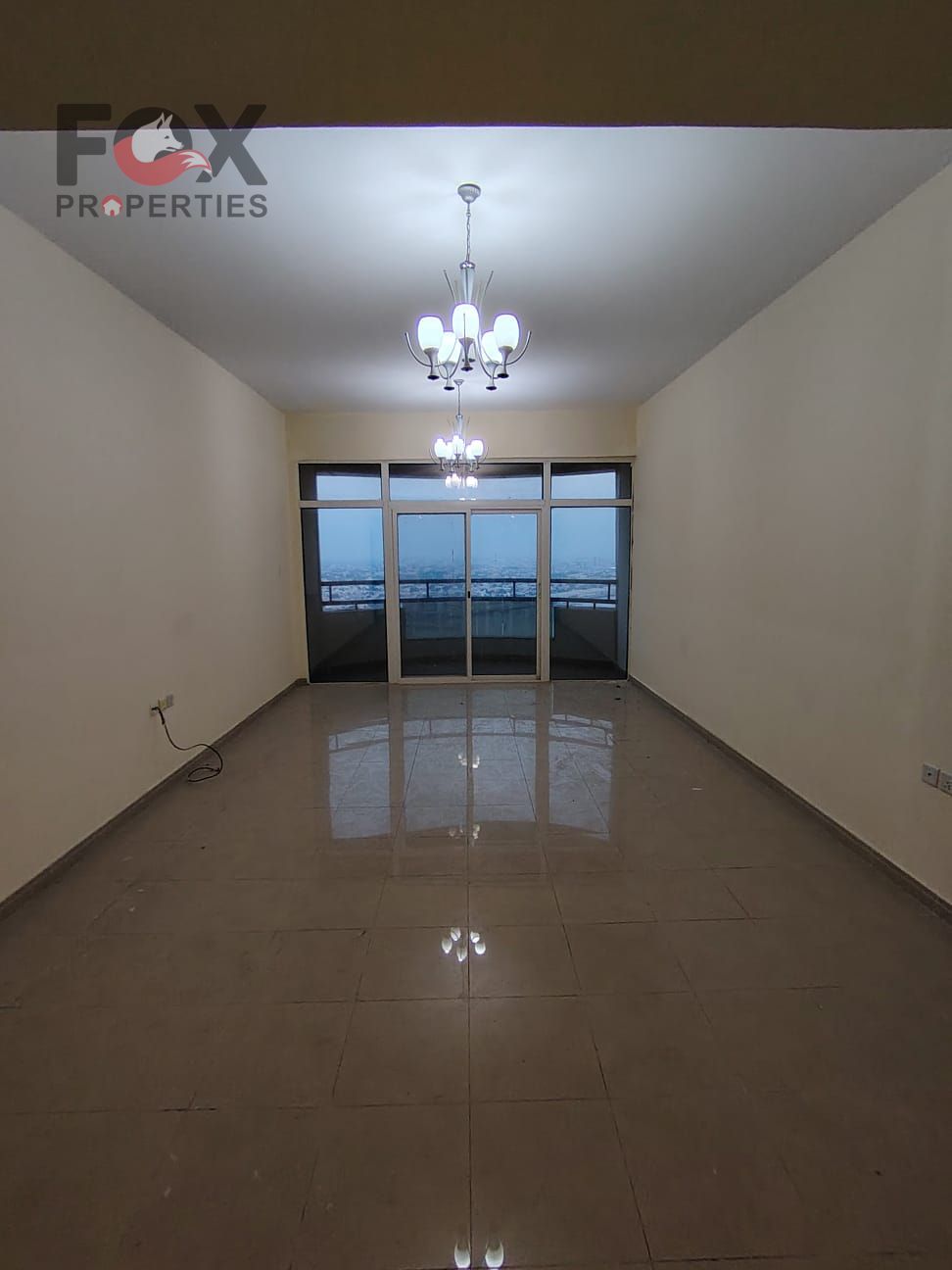 Two-bedroom apartment with a living room and a direct view of Ajman Creek in Horizon Towers, with a large area, master bedroom, built-in wardrobes and