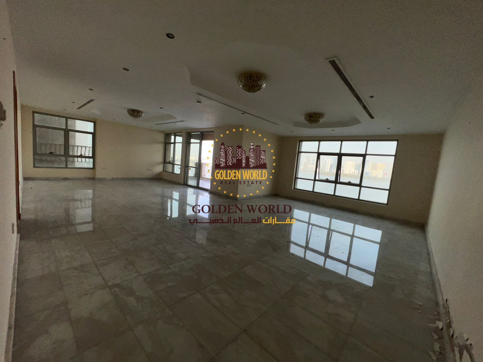 A luxurious three-bedroom apartment with a terrace balcony and parking in Al Majaz 3 on the Corniche, featuring three master bedrooms, a maid’s room,