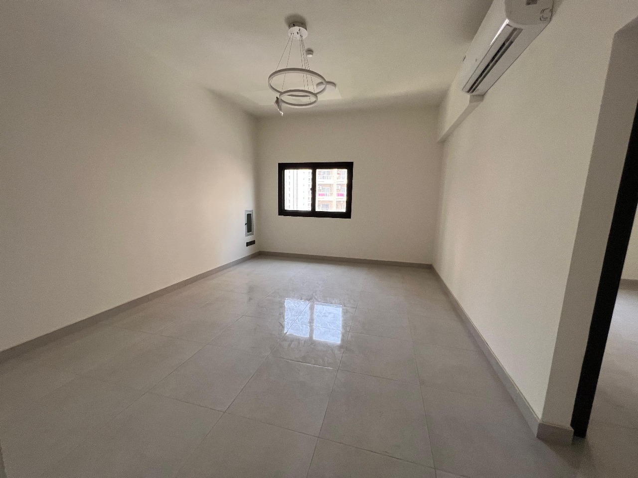 Two rooms and a hall in Al Majaz 2, first occupant, balcony, distinctive finishes, one month deferred deposit, and payment in 4-6 installments.
