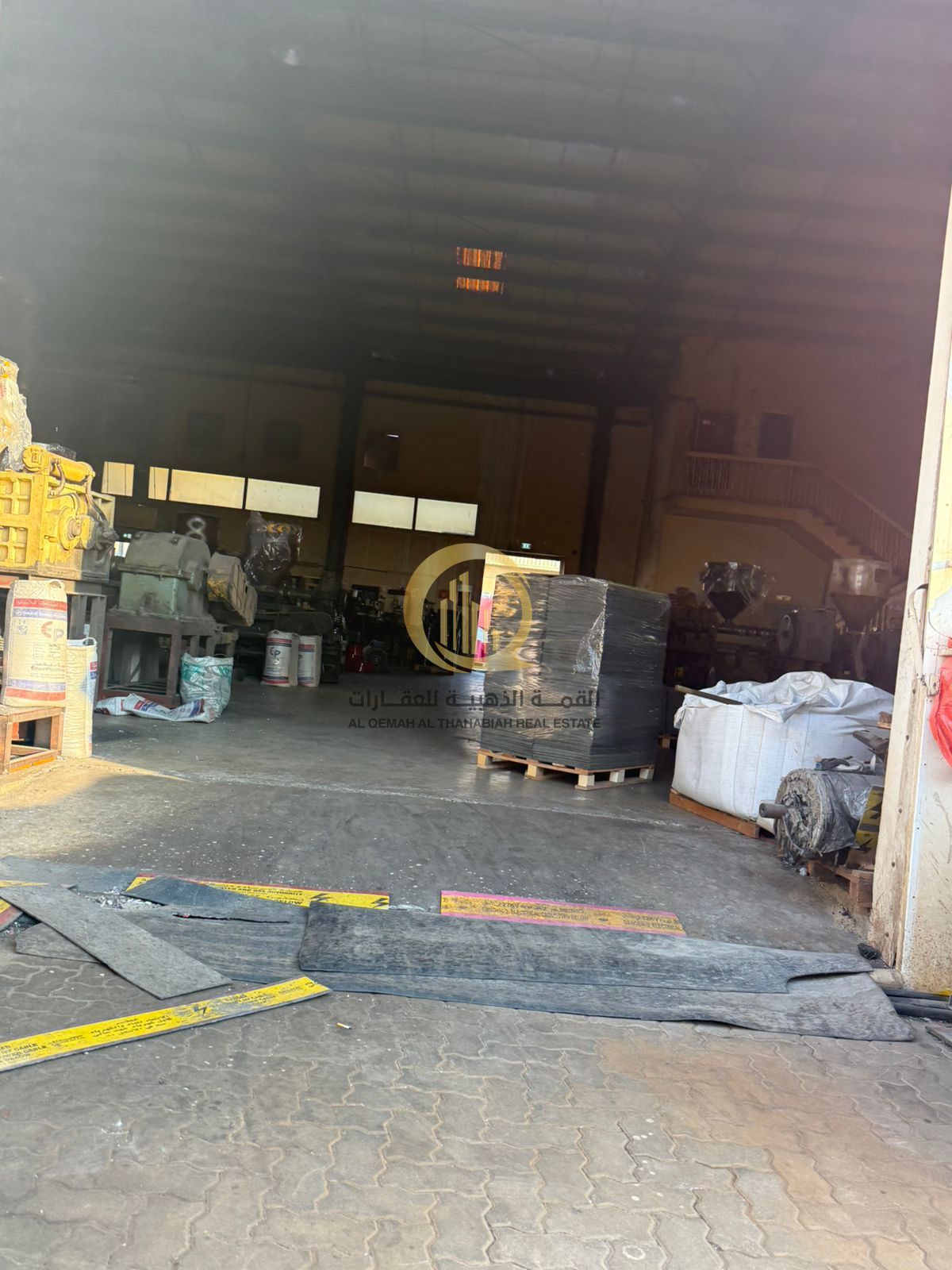 For sale: a warehouse and workers' accommodation in Al-Hannou Al-Jalil with a prime area of 32,292 sq ft, electricity, and 1000 KV power supply.