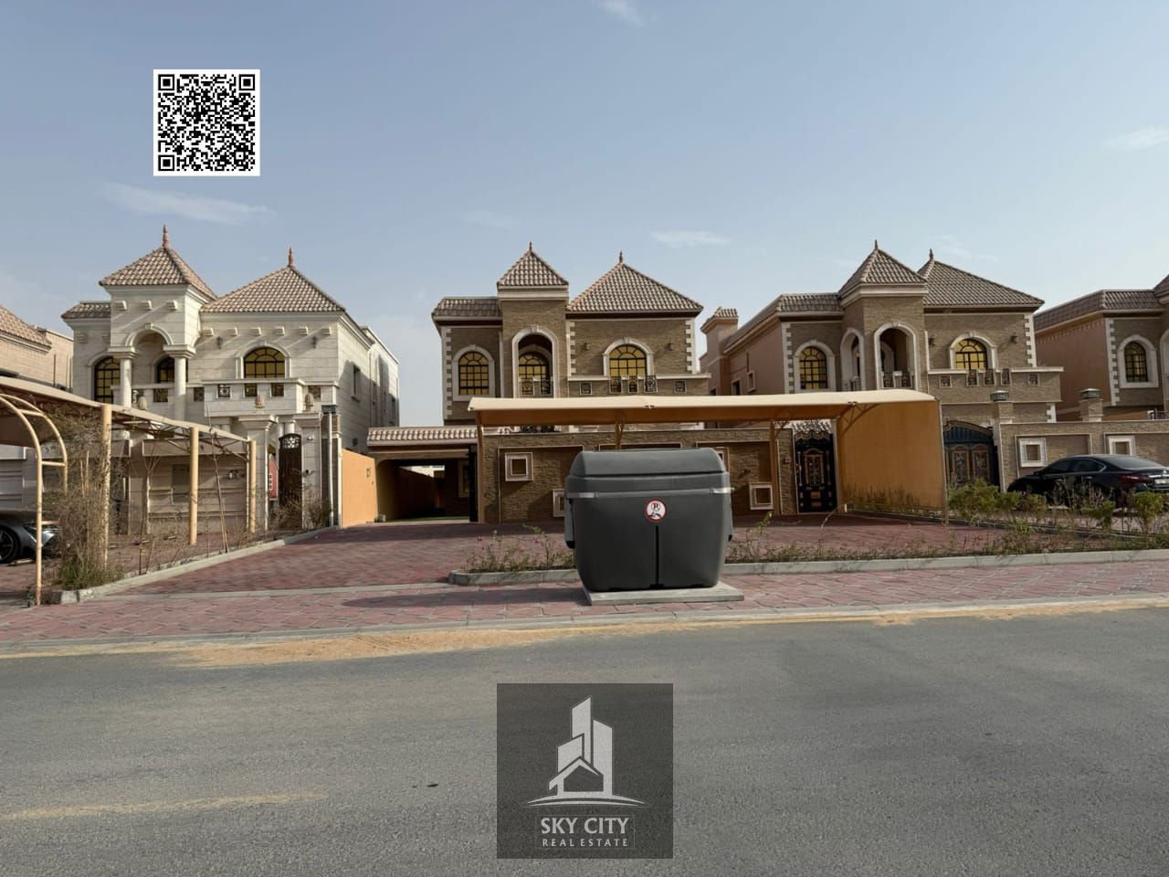 Luxury villa for sale in Al Muwaihat 2, Ajman, with a large setback. The villa is freehold and includes electricity, water, and air conditioning.