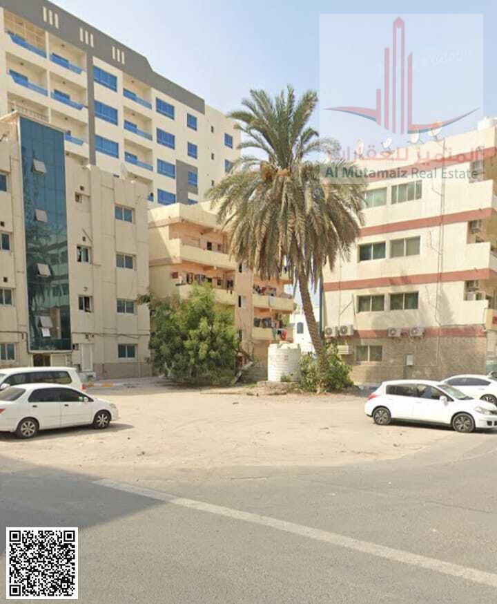 Land for sale in Ajman, Al Rumaila area, residential/commercial, ground floor + 4 floors, area 4700 sq ft, corner plot on two streets, price 2200000,