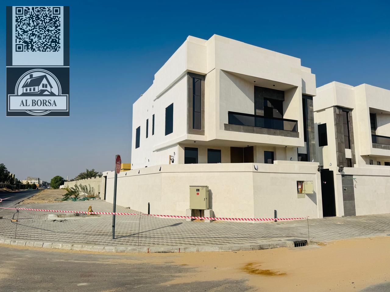For sale in Al Zahia, Ajman: Corner villa with 5 master bedrooms, majlis, living room, and maid's room.