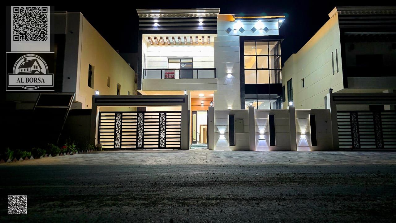 For sale in Al Bahia, Ajman: a villa with 5 master bedrooms, a majlis, a living room, a maid's room, and a spacious kitchen.