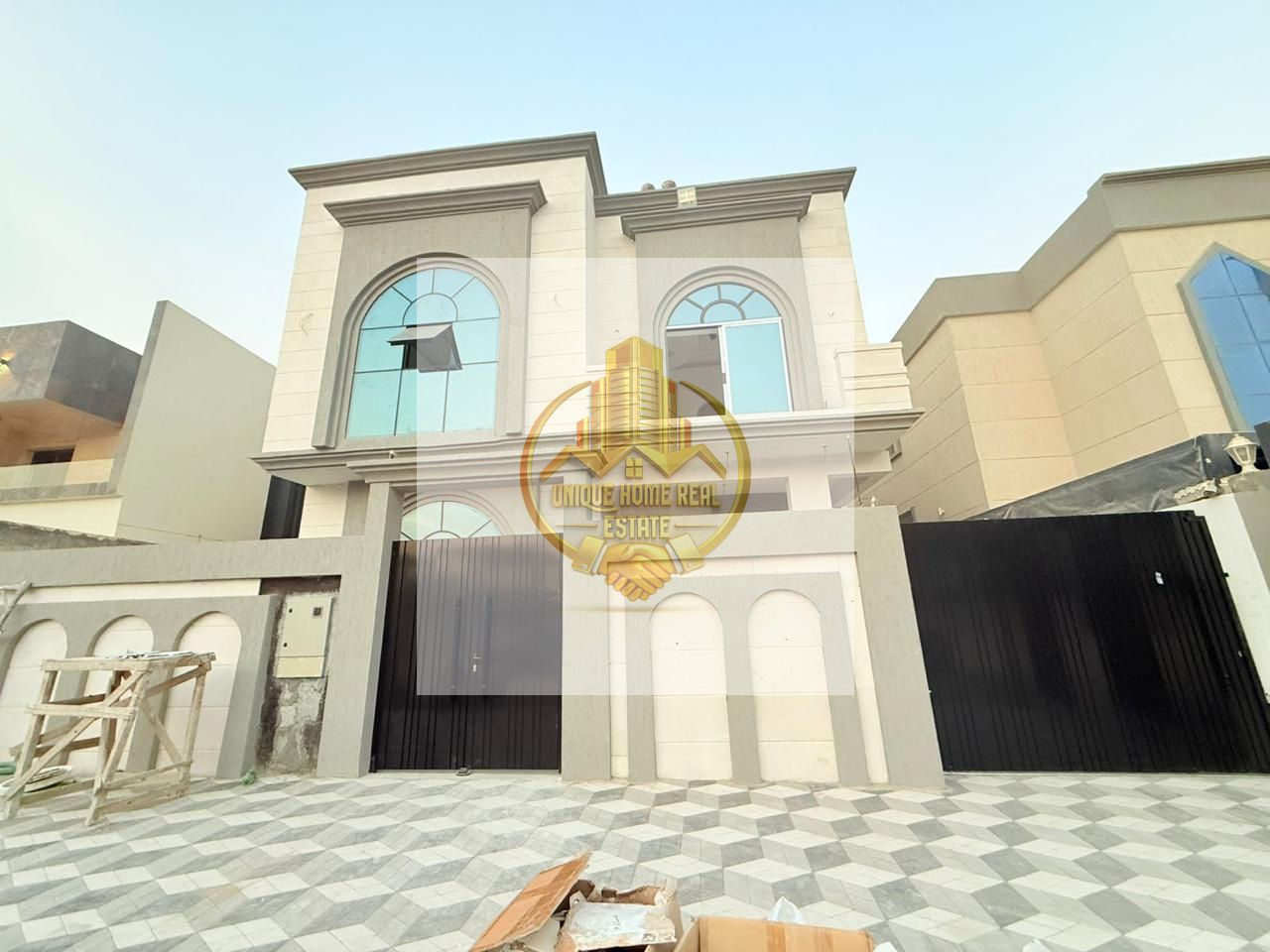 {For sale, a villa, Al Helio 2, in Ajman, 7 master bedrooms, two halls, a majlis, a maid’s room, and an internal garage.