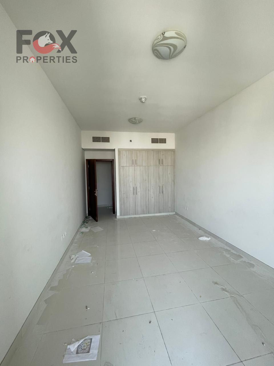 Two bedrooms and a living room with an open view in Al Rashidiya 3, in a quiet and distinguished location, with ample space, built-in wardrobes, a bal