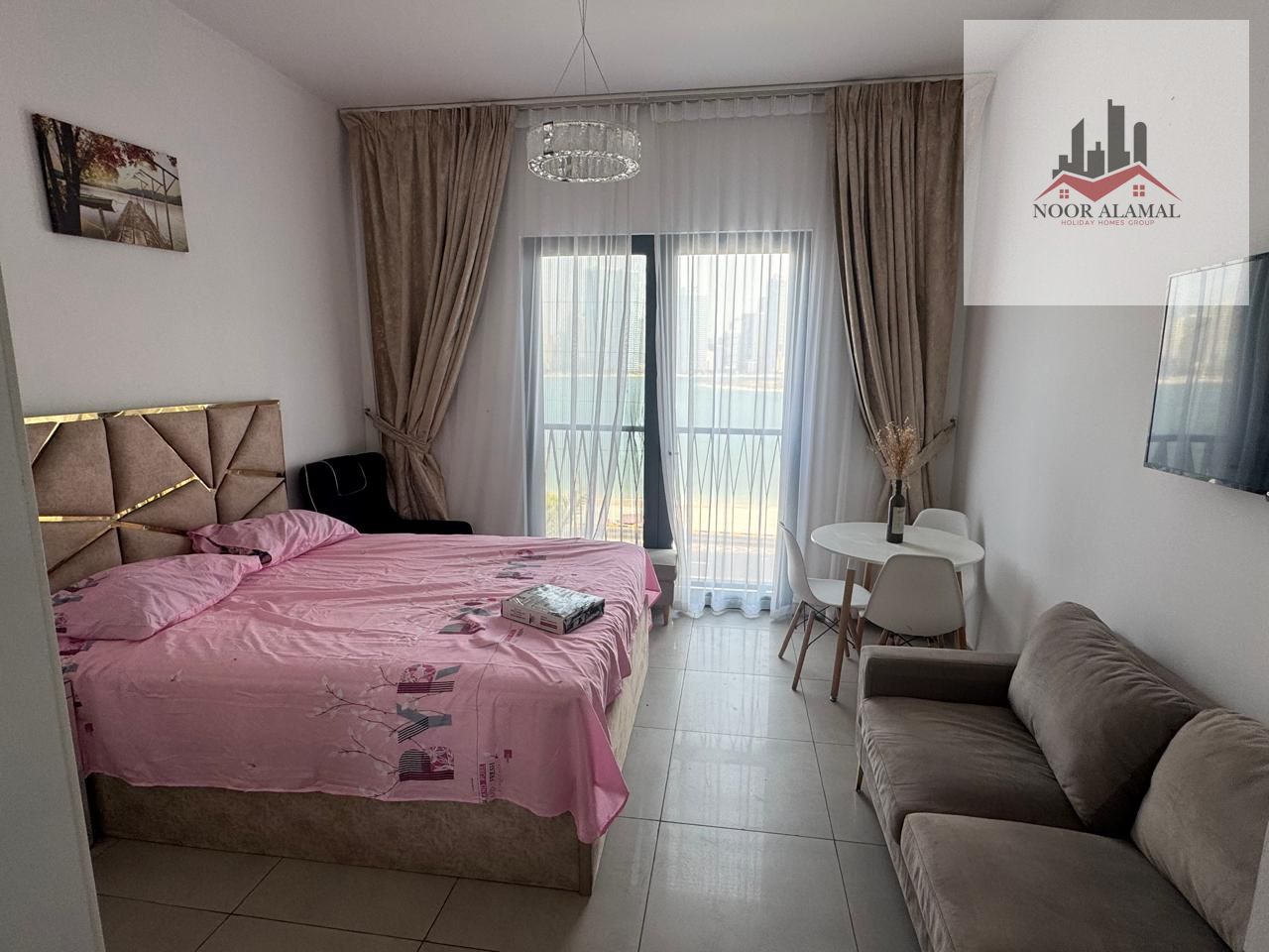 Sharjah - MARIAM ISLAND- Super Deluxe STUDIO , a large living room, a fully equipped kitchen, and bathroom