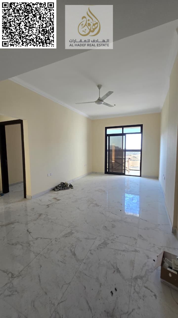 For rent in Ajman, first occupancy. In Al Jurf 3, on Sheikh Mohammed Bin Zayed Road. Two bedrooms, living room, three bathrooms, and a balcony. AED 42