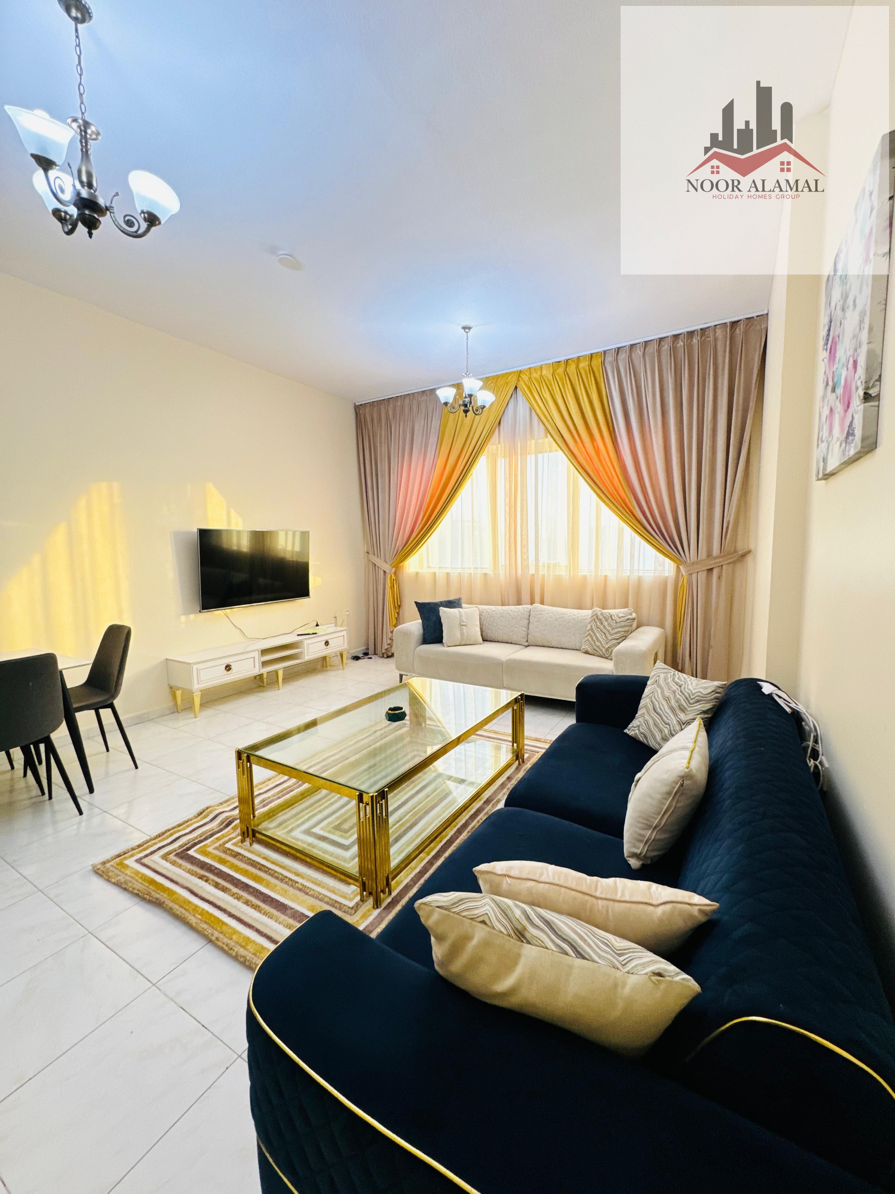 Sharjah - altaawun - Super Deluxe apartment with one bedrooms, a large living room, a fully equipped kitchen, and two bathrooms