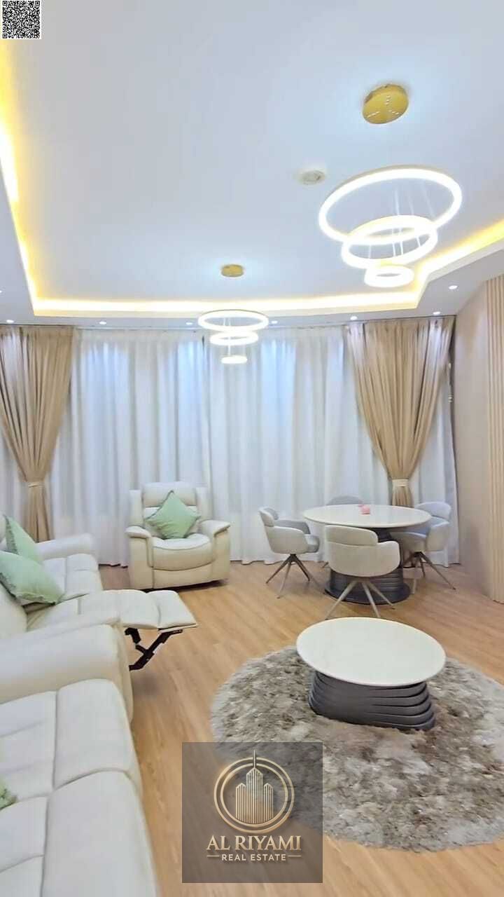 For Sale: Two-bedroom apartment with a living room, large terrace, and panoramic views of Ajman Creek – Orient Towers (Liwara