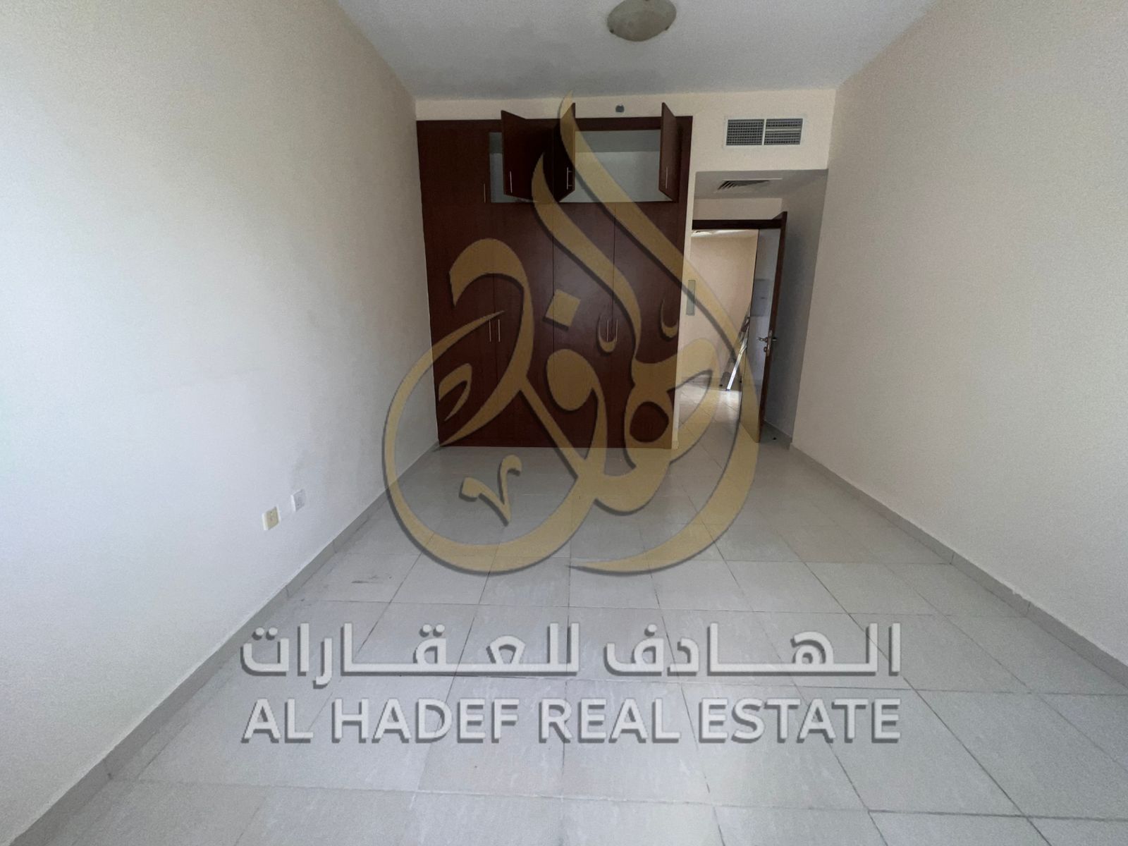 One-bedroom apartment with a separate living room, balcony, and open view in a prime location in Al Majaz 3.